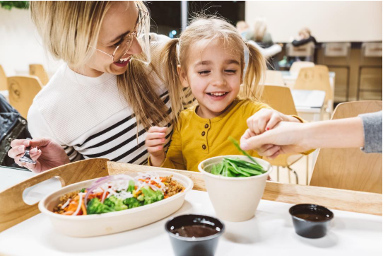 A happy family dining at Balance Pan-Asian Grille.