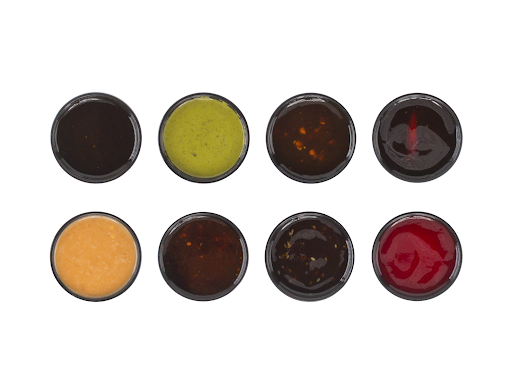 A selection of pan-Asian sauces from Balance Grille, featuring gochujang, szechuan, and sesame, made in Toledo and Cleveland, Ohio.