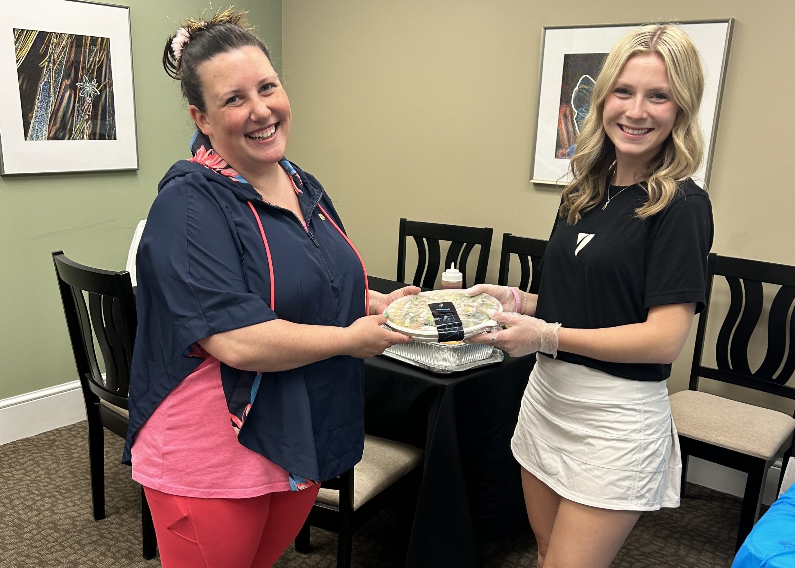 An image of a customer offering a free meal as part of Balance Gives Back.