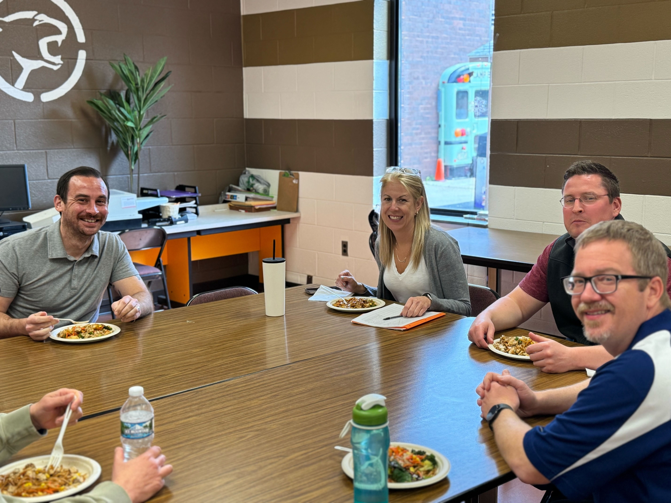 A group of people seated around the table at a Balance Give Back day.