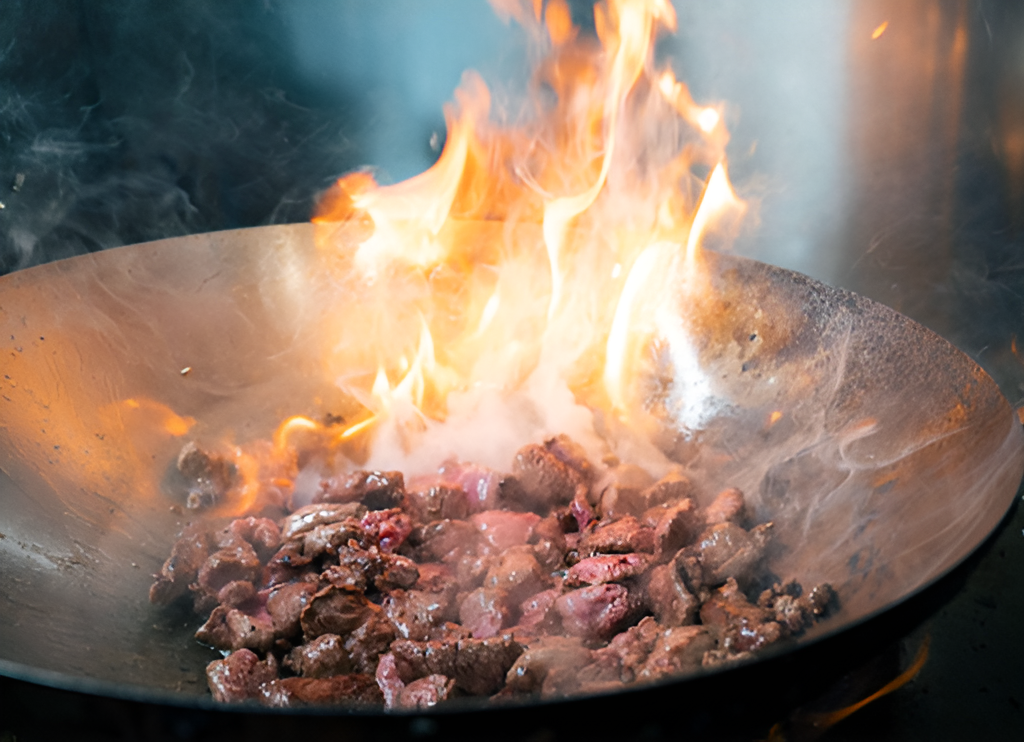 A wok-fired protein bowl being prepared in the Balance Grille kitchen.